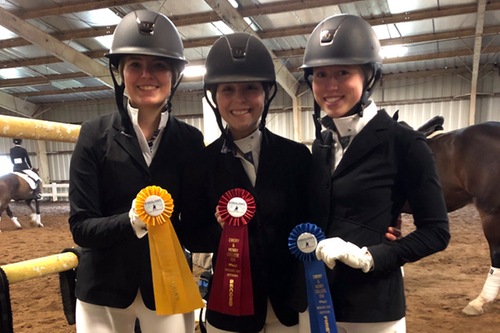 Three IDA riders pose with their ribbons.