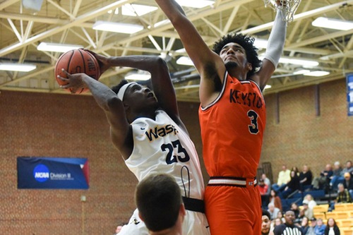 Robert Holliday, Jr. goes to the basket against a defender.