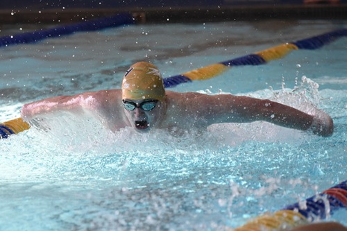 Mack Henningsen swims butterfly.