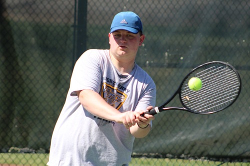 Andrew McClung hits a backhand.