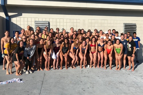 The Emory & Henry and Delaware swimming teams pose following their meet during winter training.