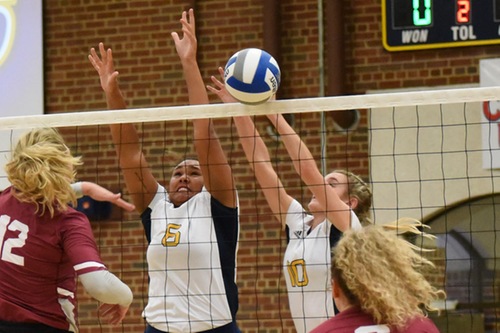 Makayla Payne (left) and Chelsie Crussell (right) go up for a block.