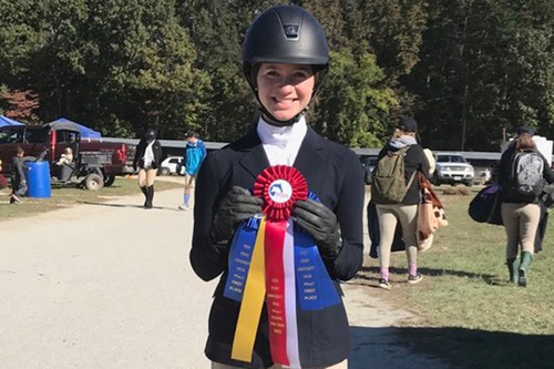 Emilie Fink poses with her ribbons from High Point Sunday.