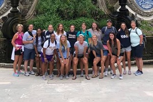 Emory & Henry women's basketball poses together while in Portugal.